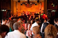 The audience dancing to Down for the Count's swing and soul function band at a wedding reception at Pinewood Studios, Buckinghamshire