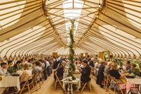 Dinner at a Buckinghamshire yurt wedding reception, photo by Potters Instinct Photography