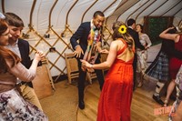 The party with live music from swing band Down for the Count at a Buckinghamshire yurt wedding reception, photo by Potters Instinct Photography