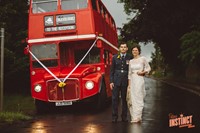 A London Routemaster bus with bride and groom at a yurt wedding reception in Buckinghamshire, photo by Potters Instinct Photography