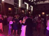 Live wedding band performing for bride and groom at reception at Selwyn College, Cambridge