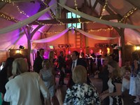 Live swing band performing at a wedding reception at Lains Barn, Oxfordshire