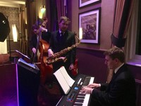 Live jazz trio performing at Berkshire corporate event