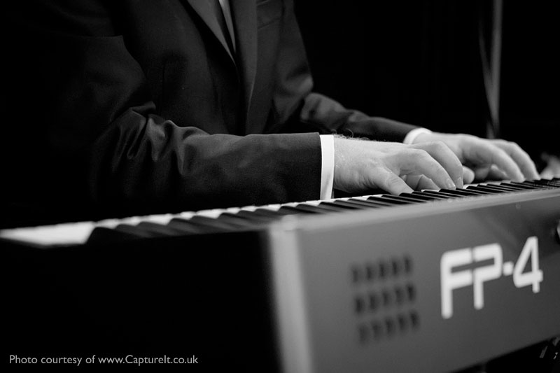 Cocktail pianist Mike Paul-Smith performing at Anthony and Becky's Wedding Reception at Pinewood Studios, Buckinghamshire.  Photo courtesy of Capture It.