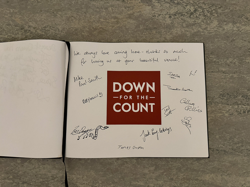The guest book at The Queen's Hall, Edinburgh, signed by the Down for the Count All-Stars