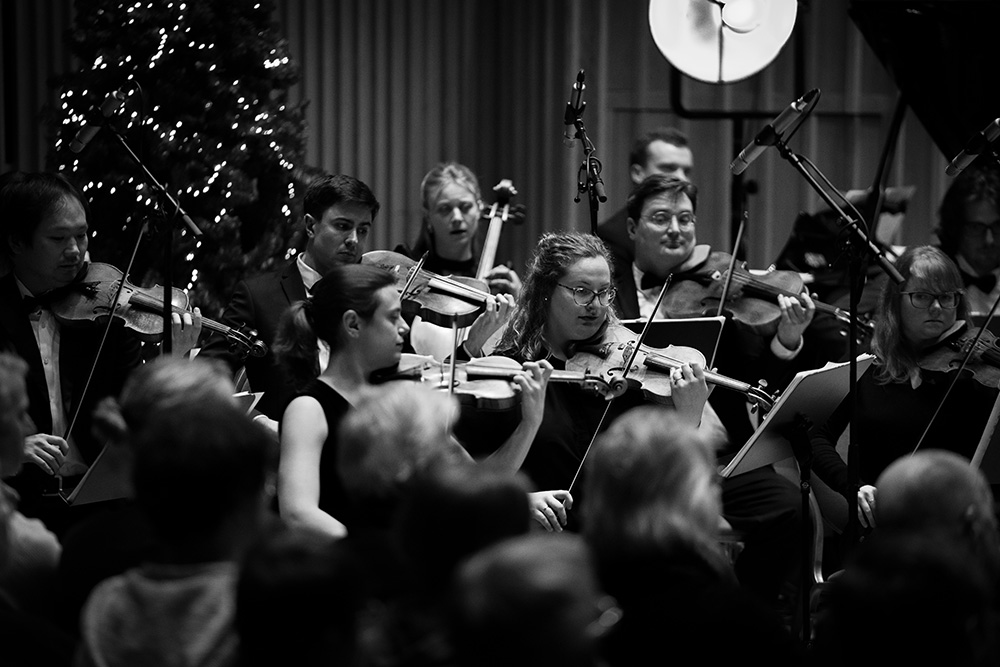 Violinist Auguste Copeland performing with Down for the Count Orchestra