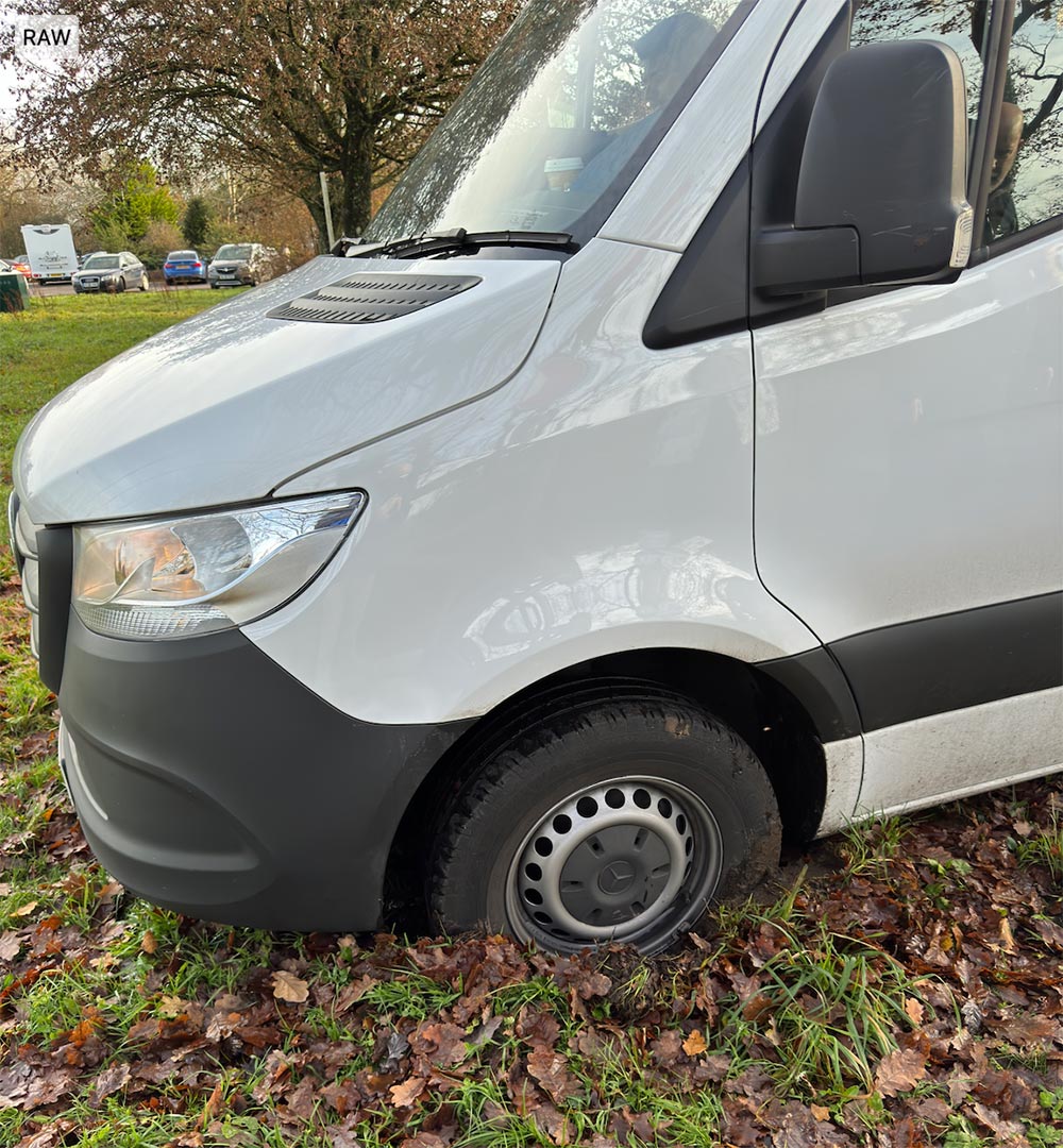 A van stuck in mud